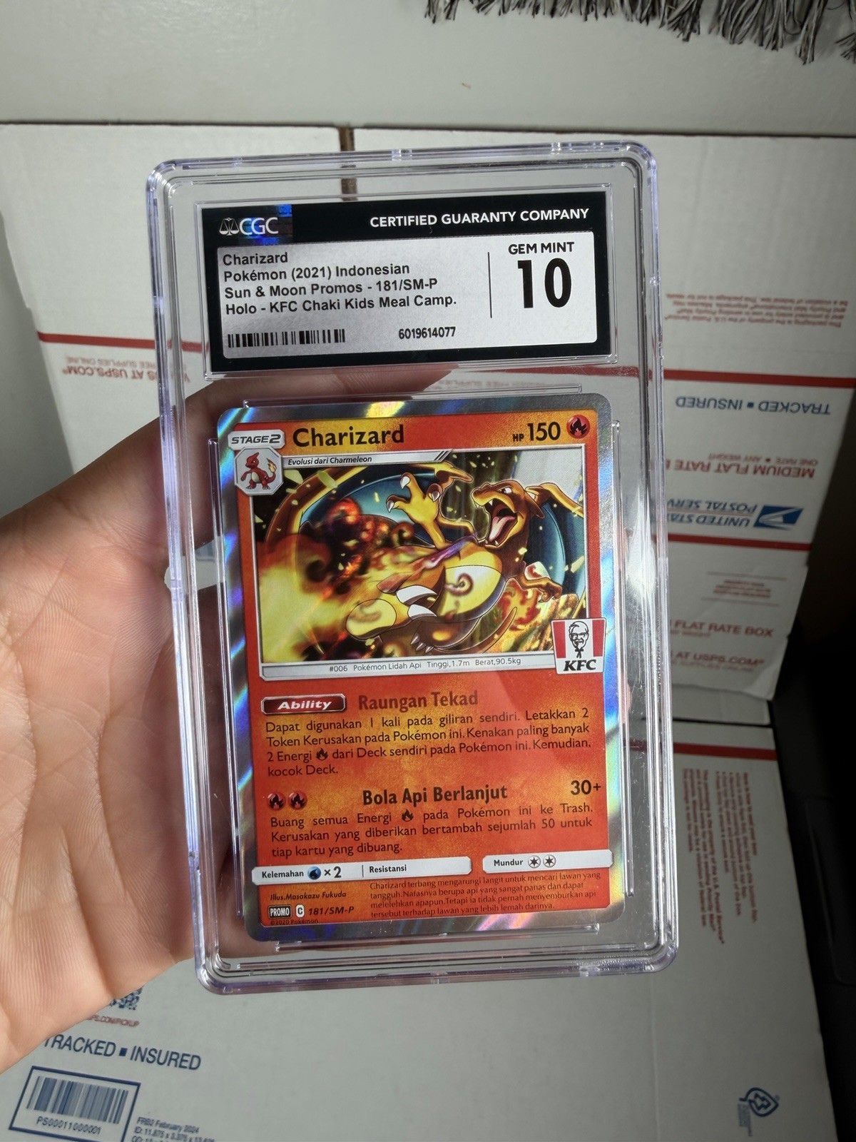 2021 Sun & Moon Promos - Indonesian Charizard Promo KFC Chaki Kids Meal (Holo) 181/SM-P